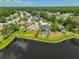 A charming neighborhood with a lakefront view offers homes with private pools and manicured lawns at 14502 Pond Cypress Way, Tampa, FL 33626