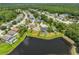 An aerial shot shows the property next to a pond and greenery at 14502 Pond Cypress Way, Tampa, FL 33626