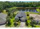 Aerial view of the front of the house and pond at 14502 Pond Cypress Way, Tampa, FL 33626