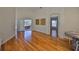 Spacious dining room with hardwood floors, slider to patio, and access to the bedroom at 14502 Pond Cypress Way, Tampa, FL 33626