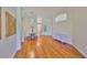 Bright dining room area with views of living room, hardwood flooring, and designer furnishings at 14502 Pond Cypress Way, Tampa, FL 33626