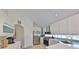 Clean, well-lit kitchen featuring stainless steel appliances and sleek white cabinetry at 14502 Pond Cypress Way, Tampa, FL 33626