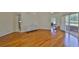 Living area with hardwood floors, sliding glass doors to patio and pool, with access to kitchen at 14502 Pond Cypress Way, Tampa, FL 33626