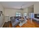 Spacious living room with vaulted ceiling, hardwood floors, and contemporary furnishings and backyard view at 14502 Pond Cypress Way, Tampa, FL 33626