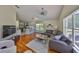 Bright living room with hardwood floors, modern furniture, and natural light at 14502 Pond Cypress Way, Tampa, FL 33626