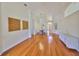 Open concept living area with hardwood floors, dining space, and bright lighting at 14502 Pond Cypress Way, Tampa, FL 33626