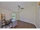 Office with a large window that provides natural light and a ceiling fan at 14502 Pond Cypress Way, Tampa, FL 33626