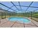 The screened-in pool and brick patio offer a tranquil outdoor space for relaxation and enjoyment at 14502 Pond Cypress Way, Tampa, FL 33626