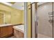 Bathroom featuring a soaking tub, shower stall, and vanity with sink at 14561 El Paseo Dr, Seminole, FL 33776