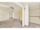 Open bedroom with neutral carpet, an attached closet, and adjoining rooms at 14561 El Paseo Dr, Seminole, FL 33776