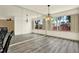Bright dining room with stylish flooring and oversized wall mirror at 14561 El Paseo Dr, Seminole, FL 33776