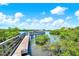 Enjoy a peaceful walk on the community pier with views of the water at 14561 El Paseo Dr, Seminole, FL 33776