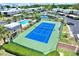 Enjoy a match on the community tennis court, near the pool, pond, and convenient parking at 14561 El Paseo Dr, Seminole, FL 33776