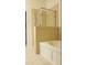 Bathroom showcasing a tub with tile surround and a glass shower at 1508 Talisker Dr, Clearwater, FL 33755