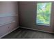 Bedroom with neutral carpet, window, and shelving at 1508 Talisker Dr, Clearwater, FL 33755