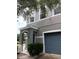 Two-story home featuring a two-tone paint scheme, archway entry, and an attached one-car garage at 1508 Talisker Dr, Clearwater, FL 33755