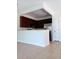 Kitchen featuring stainless steel appliances, dark wood cabinets and neutral countertops at 1508 Talisker Dr, Clearwater, FL 33755