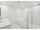 Bright bathroom featuring double vanity, shower, and soaker tub with white tile surround at 17729 Nectar Flume Dr, Land O Lakes, FL 34638