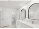 Spacious bathroom with dual sinks, modern fixtures, a vanity, and a separate toilet room at 17729 Nectar Flume Dr, Land O Lakes, FL 34638