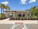 Clubhouse with palm trees and accessible parking spaces providing a tropical and inclusive environment at 17729 Nectar Flume Dr, Land O Lakes, FL 34638