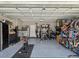 Spacious garage with high ceilings, fitness equipment, and storage for bikes at 17729 Nectar Flume Dr, Land O Lakes, FL 34638
