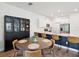 Open-concept kitchen with stainless steel appliances, quartz countertops, breakfast bar, and adjacent dining area at 17729 Nectar Flume Dr, Land O Lakes, FL 34638