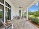 Inviting covered patio with rocking chairs, providing a relaxing outdoor space at 17729 Nectar Flume Dr, Land O Lakes, FL 34638