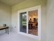 Covered patio with sliding glass doors to the dining area, seamlessly blending indoor and outdoor living at 17729 Nectar Flume Dr, Land O Lakes, FL 34638