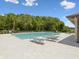 Community pool surrounded by lounge chairs providing a relaxing and enjoyable outdoor space at 17729 Nectar Flume Dr, Land O Lakes, FL 34638