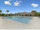 Community pool offering ample space for swimming and leisure, with lounge area and mature landscaping at 17729 Nectar Flume Dr, Land O Lakes, FL 34638