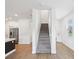 Bright entryway with staircase leading to the second floor at 17729 Nectar Flume Dr, Land O Lakes, FL 34638