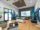 Bright welcome center with modern decor, informational displays, and comfortable seating at 17729 Nectar Flume Dr, Land O Lakes, FL 34638