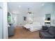 Bright bedroom with a modern bed frame, neutral colors, and a ceiling fan for added comfort at 1903 Curry Rd, Lutz, FL 33549