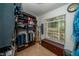 Well-organized closet featuring shelves, hanging rods, and a window for natural light and ventilation at 1903 Curry Rd, Lutz, FL 33549