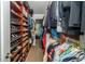 Spacious walk-in closet with shelving and hanging racks to organize all of your clothes and shoes at 1903 Curry Rd, Lutz, FL 33549