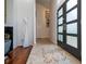 Beautiful foyer with unique tile design, hardwood floors, and striking architectural details at 1903 Curry Rd, Lutz, FL 33549