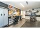 Well-organized garage with ample storage, workbench, and diamond plate flooring at 1903 Curry Rd, Lutz, FL 33549