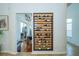 Stylish wine rack display for the wine enthusiast, enhancing the home's sophisticated ambiance at 1903 Curry Rd, Lutz, FL 33549