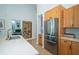 Gourmet kitchen with stainless steel appliances, wine rack and white countertops at 1903 Curry Rd, Lutz, FL 33549