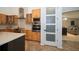 Modern kitchen with stainless steel appliances and a view into the living room at 1903 Curry Rd, Lutz, FL 33549
