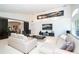 Open-concept living room with plenty of seating and entertainment space at 1903 Curry Rd, Lutz, FL 33549