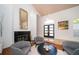 Elegant living room with high ceilings, fireplace, and modern decor, creating a sophisticated ambiance at 1903 Curry Rd, Lutz, FL 33549