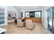 Elegant living room with tile flooring, large windows, and comfortable seating at 1903 Curry Rd, Lutz, FL 33549