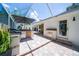 Outdoor kitchen area with built-in grill and bar, ideal for outdoor cooking and entertaining guests at 1903 Curry Rd, Lutz, FL 33549
