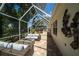 Inviting patio with comfortable seating and a view of the pool area at 1903 Curry Rd, Lutz, FL 33549