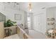 Bright Bedroom with a crib, chair, and shelving for books and decorations at 1914 Elk Spring Dr, Brandon, FL 33511