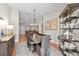 Dining room with wood table, elegant chandelier, and decorative shelving at 1914 Elk Spring Dr, Brandon, FL 33511