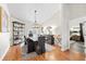 Elegant dining room featuring modern chandelier, hardwood floors, and stylish decor for memorable gatherings at 1914 Elk Spring Dr, Brandon, FL 33511