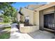 Close-up of front entry showing front door, brick accents, and landscaped flower bed at 1914 Elk Spring Dr, Brandon, FL 33511