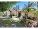 Charming single Gathering home with a well-maintained lawn, lush landscaping, and a two-car garage at 1914 Elk Spring Dr, Brandon, FL 33511